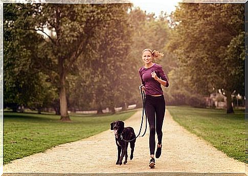 woman running with dog